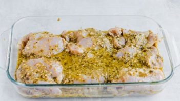 marinaded pesto chicken in a casserole dish