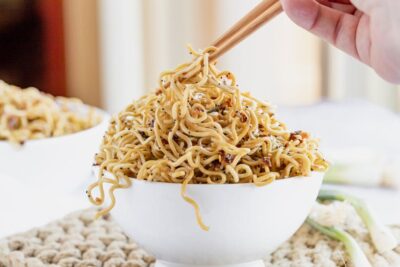 grabbing a bite of ramen noodles with chopsticks