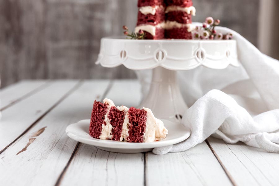 slice of keto red velvet cake on a plate