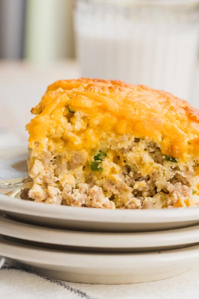 Close up of an egg, sausage casserole topped with cheese.