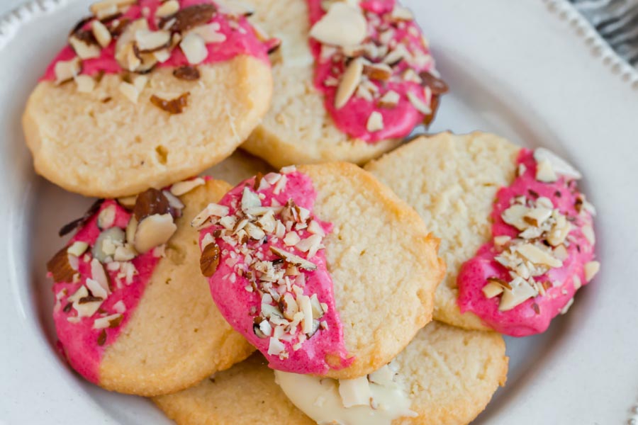 plate of red chocolate dipped keto shortbread cookies