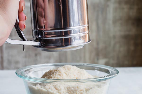 using a sifter to mix dry ingredients