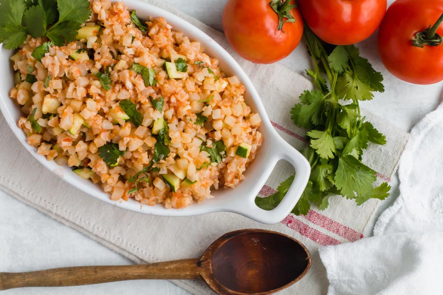 overhead view of a casserole dish filled with keto mexican rice