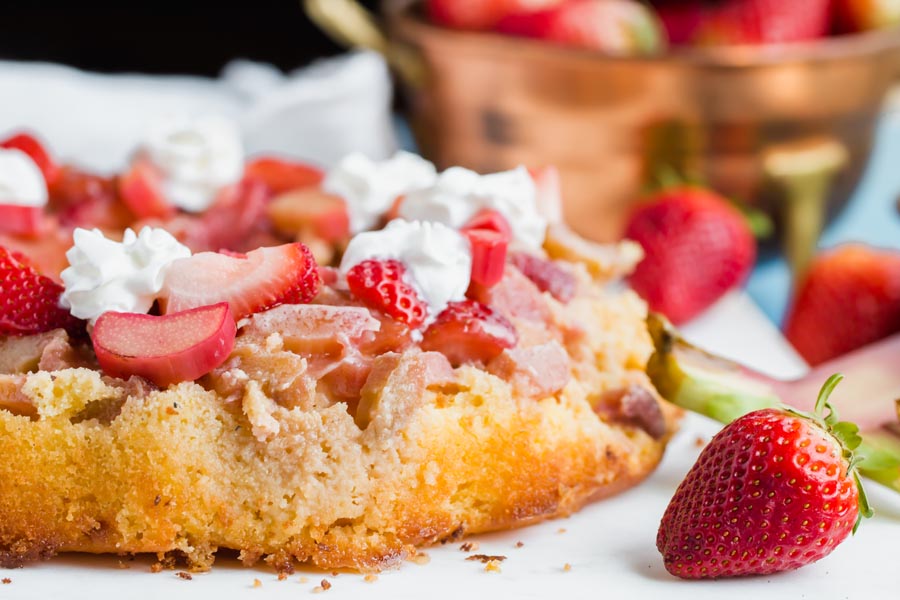 buttery strawberry rhubarb syrup dripping down a keto cake