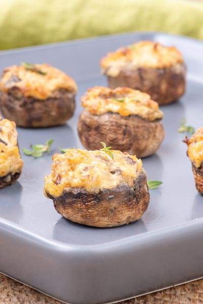 Ground sausage stuffed mushrooms on a tray.