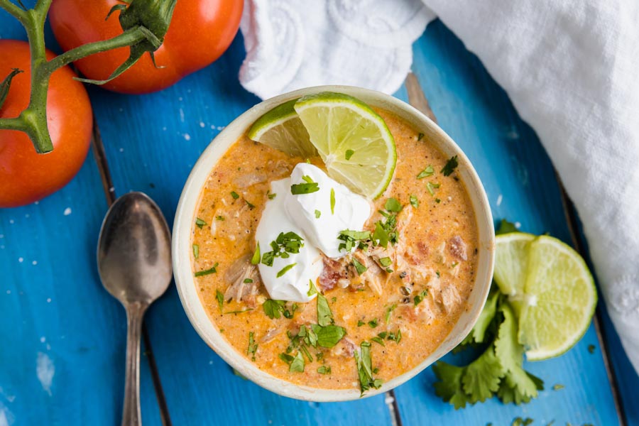 white chili topped with cilantro and lime slices