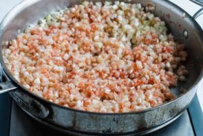 spanish rice cooking in a skillet