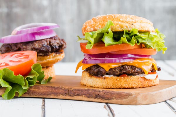 stacked keto hamburger with all the fixings