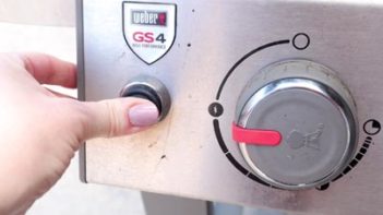 turning grill knob to preheat outdoor grill