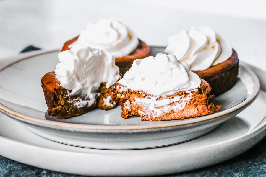 slicing into a mini pumpkin pie