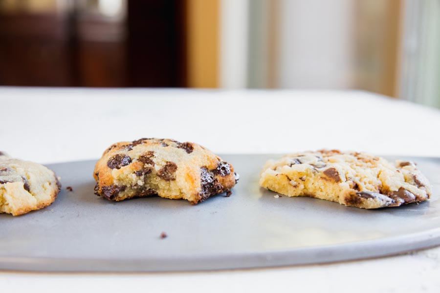 three half eaten keto cookies on a plate